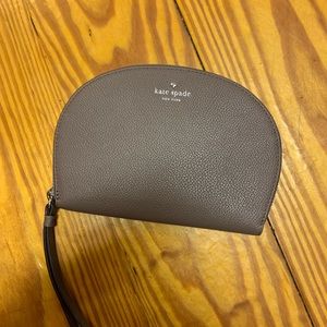 Kate spade wristlet in new condition with tags